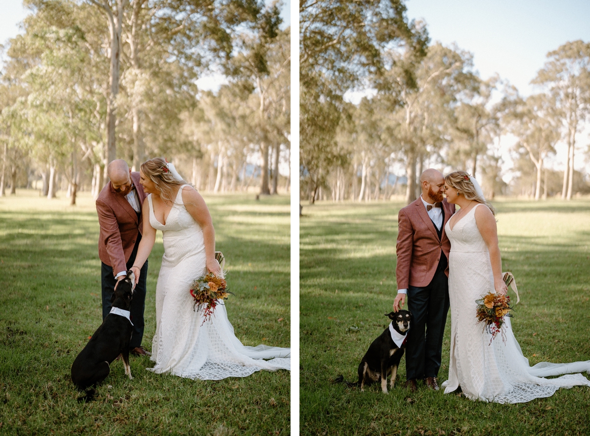 A newly wed couple embracing with their pet dog at their feet from their south coast backyard wedding.