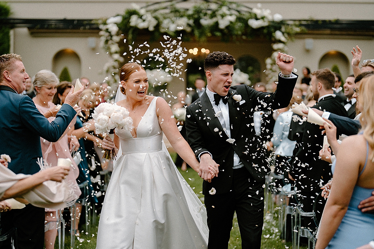 A confetti throw on a bride and groom at their Hopewood House wedding.