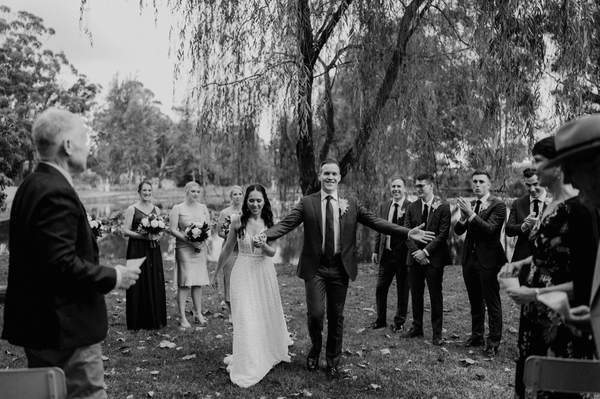 A bride and groom celebrating in black in white at their Mali Brae Farm wedding!