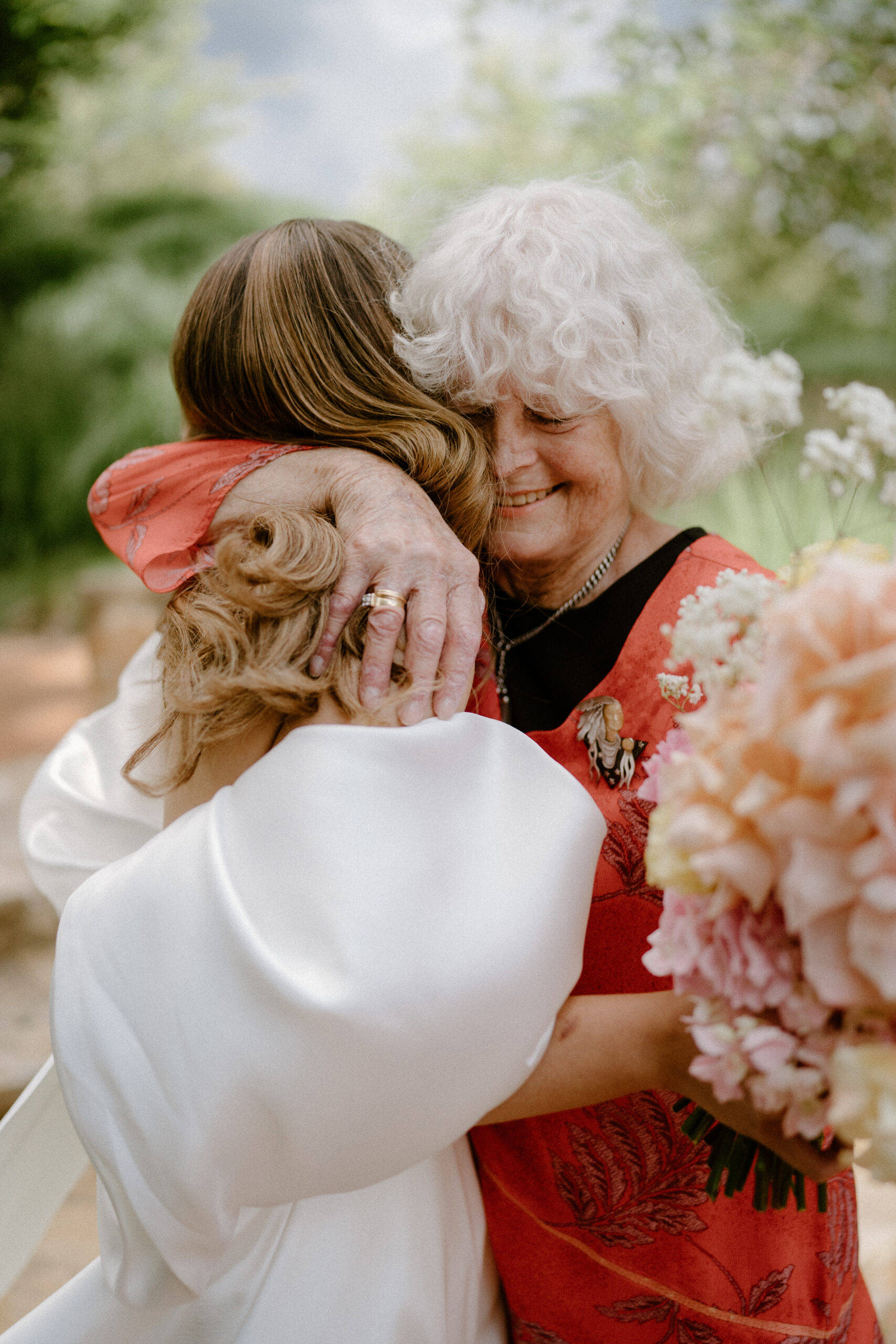A bride hugging her grand mother at her micro wedding.